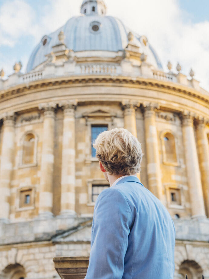 Man looking up at an historical building