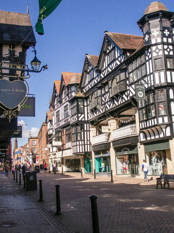 City high street with historic buildings and shops