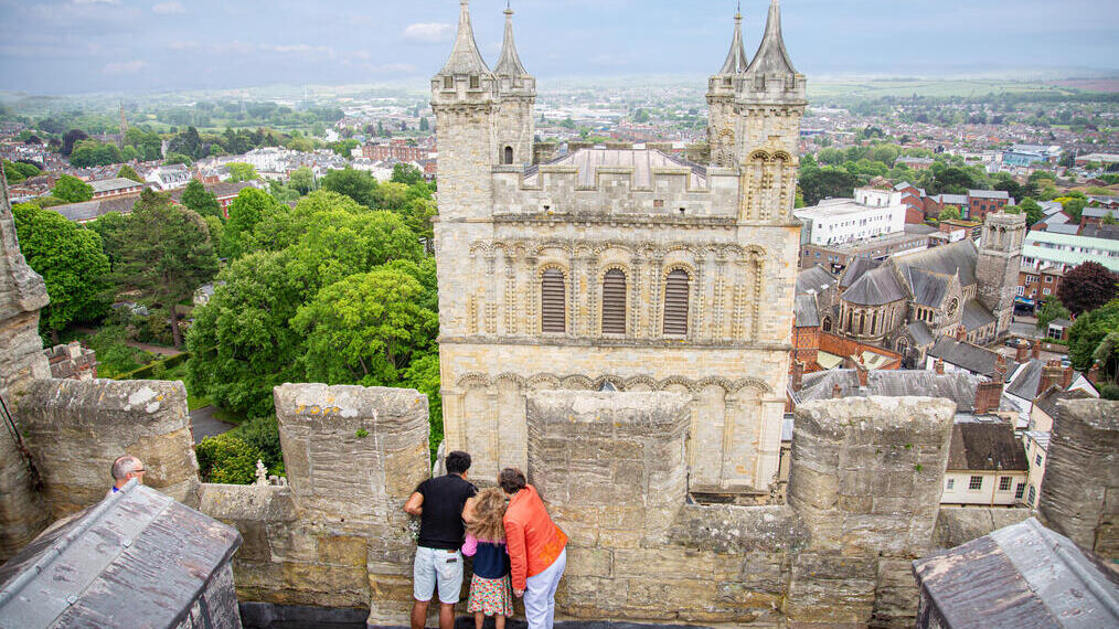 Aerial view of people looking down from a tower at Exeter Cathedral
