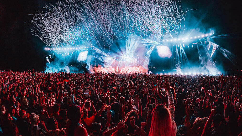 Crowd in front of the main stage at a music festival