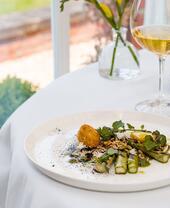 Plate of food on a set table