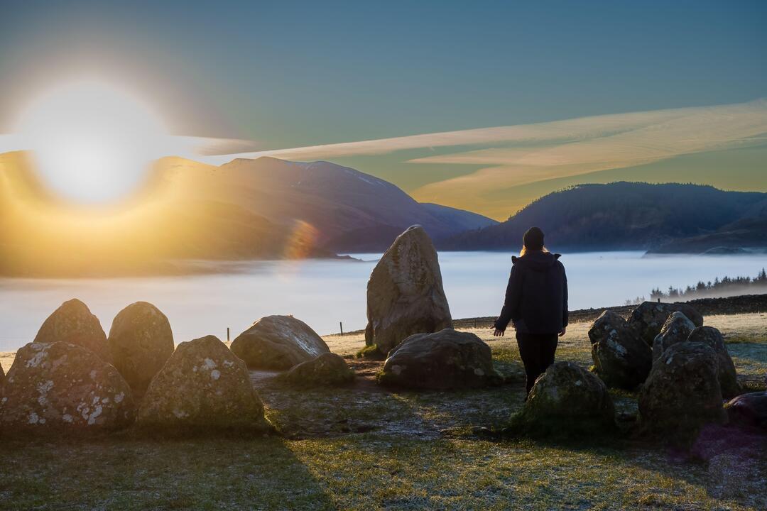 People attending the Winter Solstice celebration at Castelrigg Stone Circle near Keswick in Cumbria