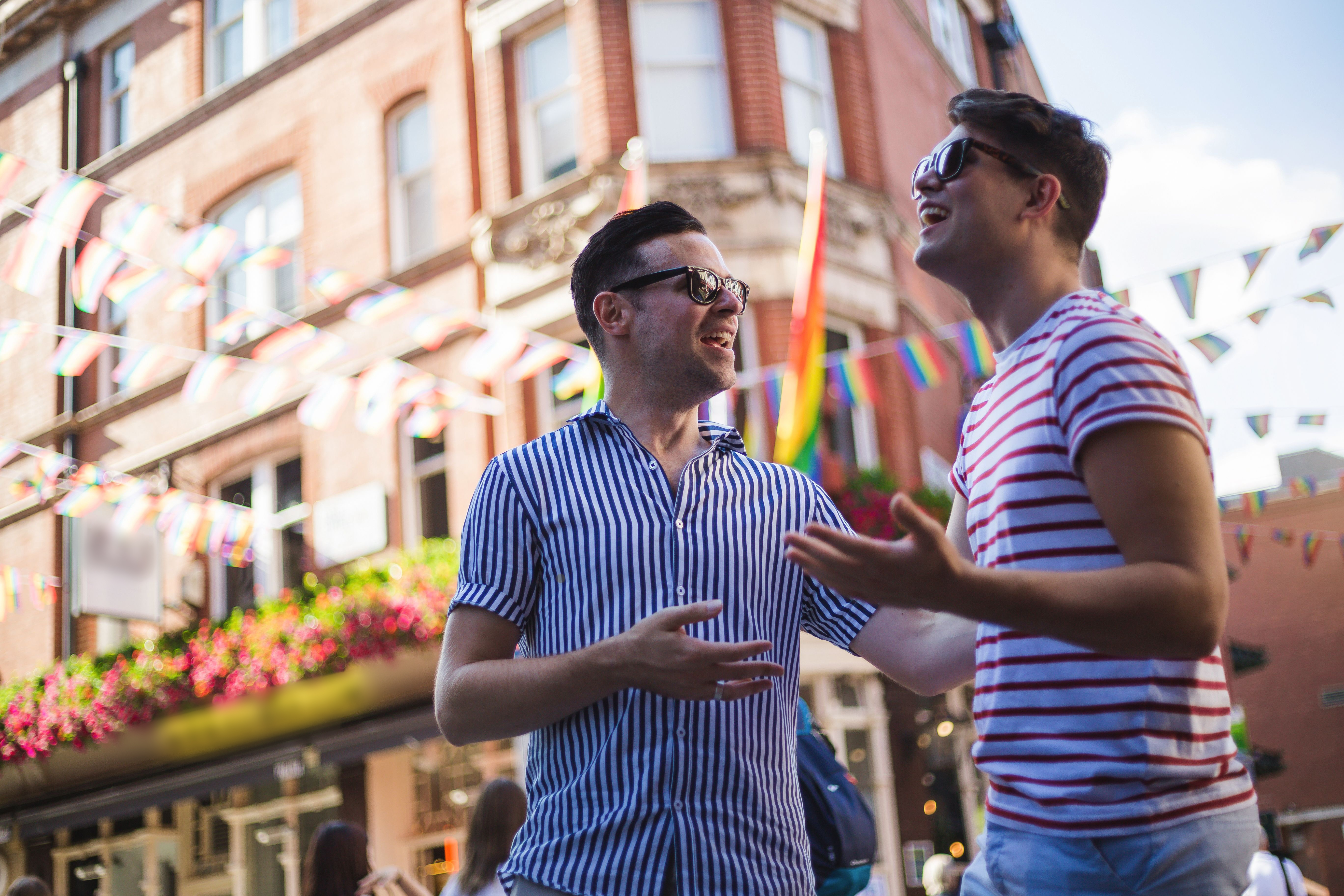 Young men talk outside a bar