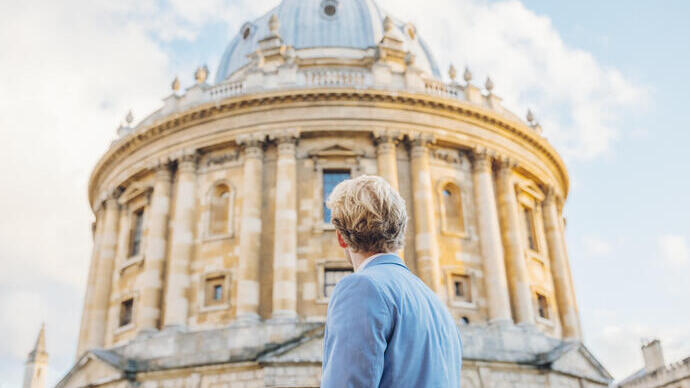 Man looking up at an historical building