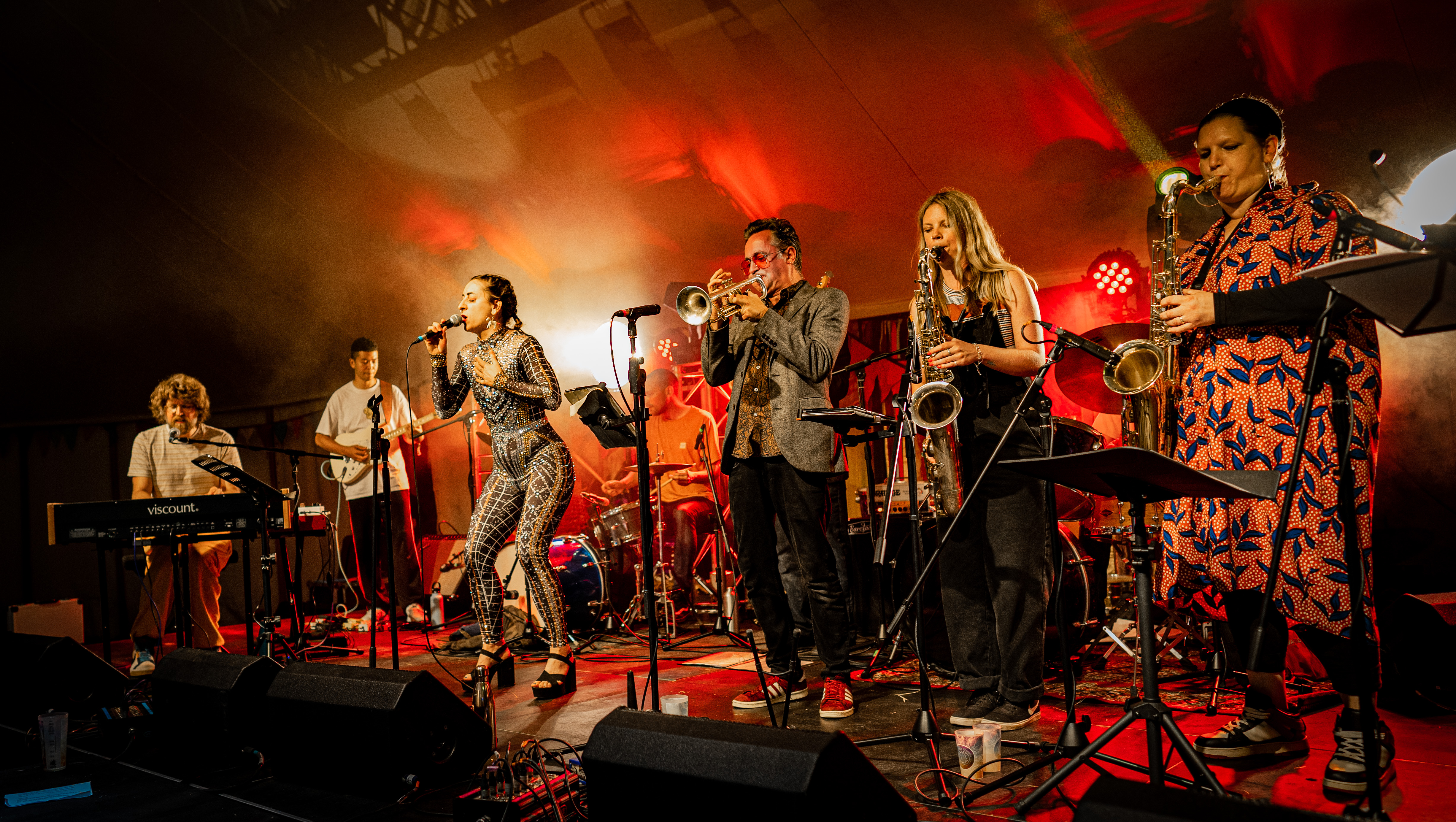 A brass band performing on stage at Unearthed Festival in Wales