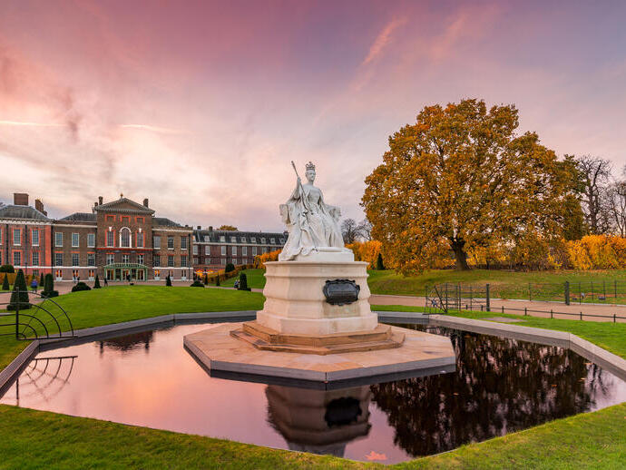 View of the garden at Kensington Palace including statue and pond