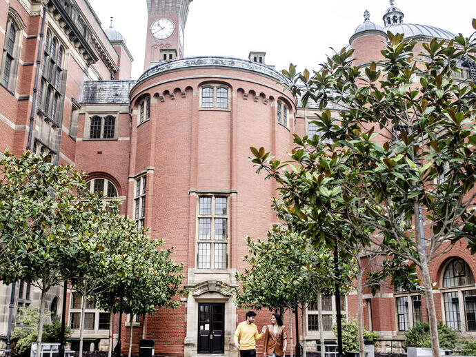 Couple strolling through the grounds of University of Birmingham