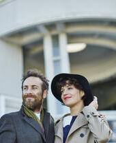 Couple standing outside a building