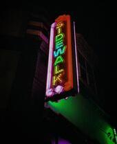 Neon sign saying sidewalk in Birmingham, England
