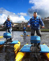 People on hydrobikes on the river Erne, Enniskillen