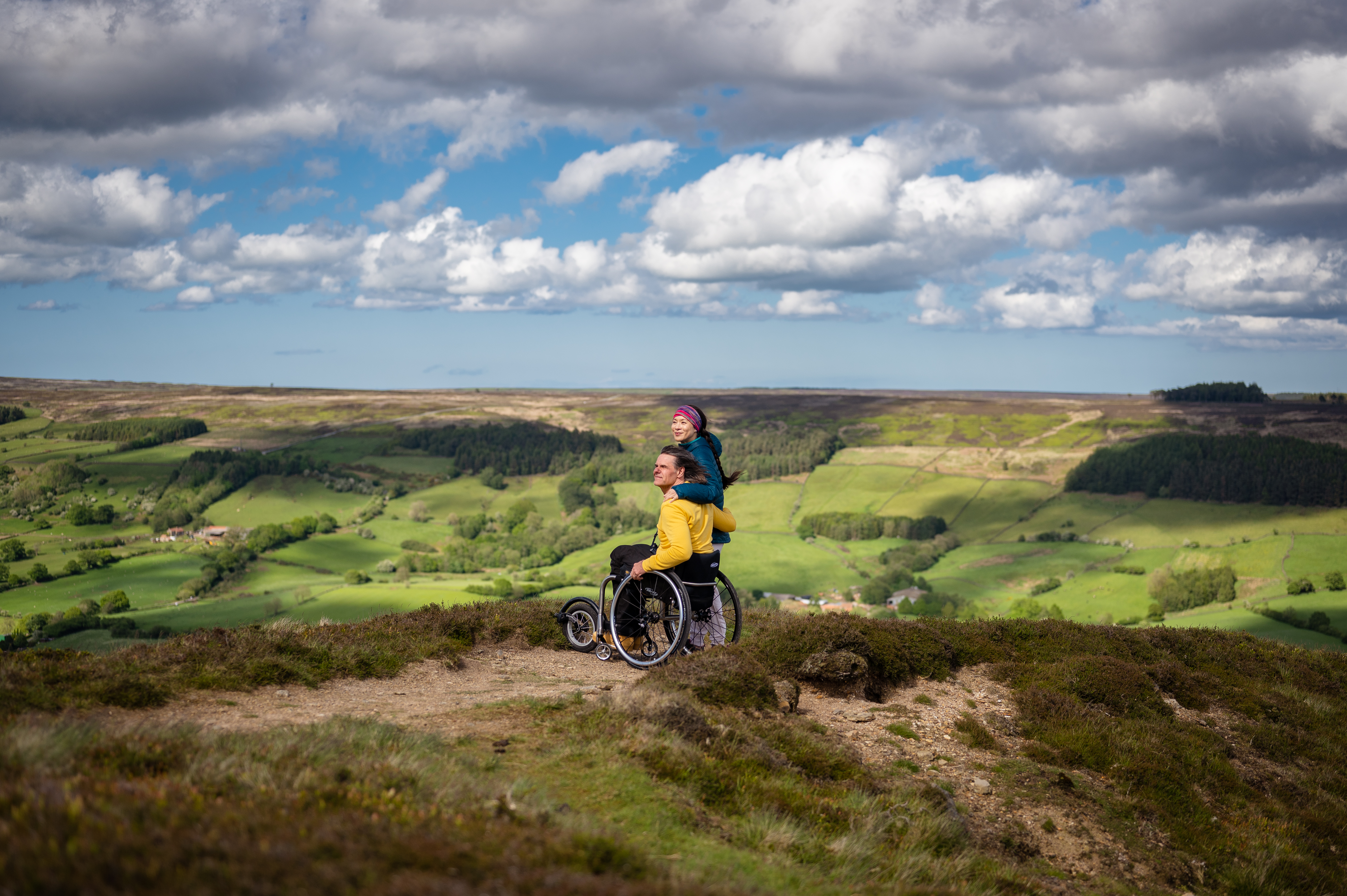 Man and woman at Bank Top, Rosedale, man using a wheelchair.