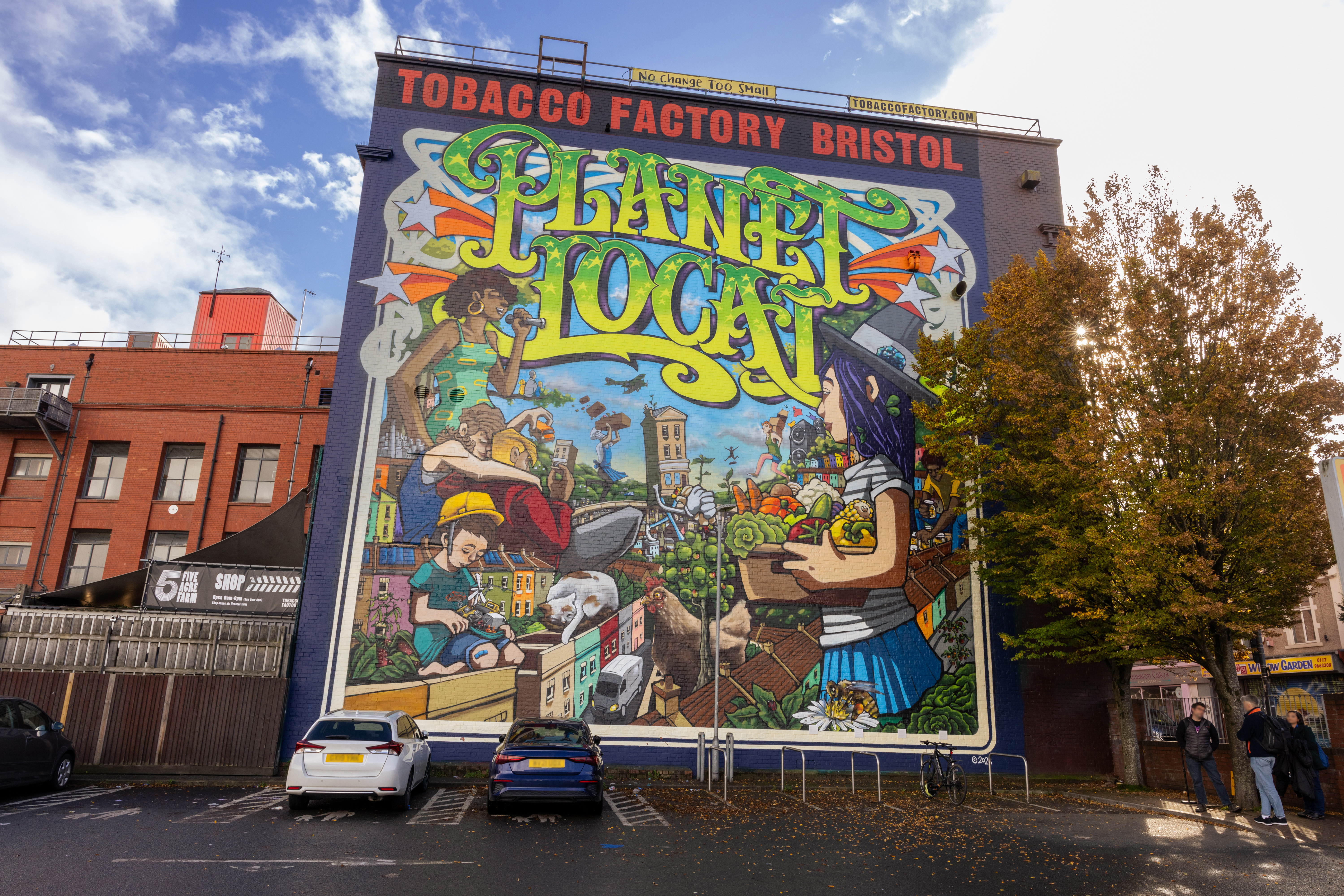 View of colourful street mural on the side of a building