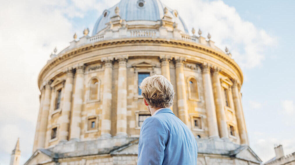 Man looking up at an historical building