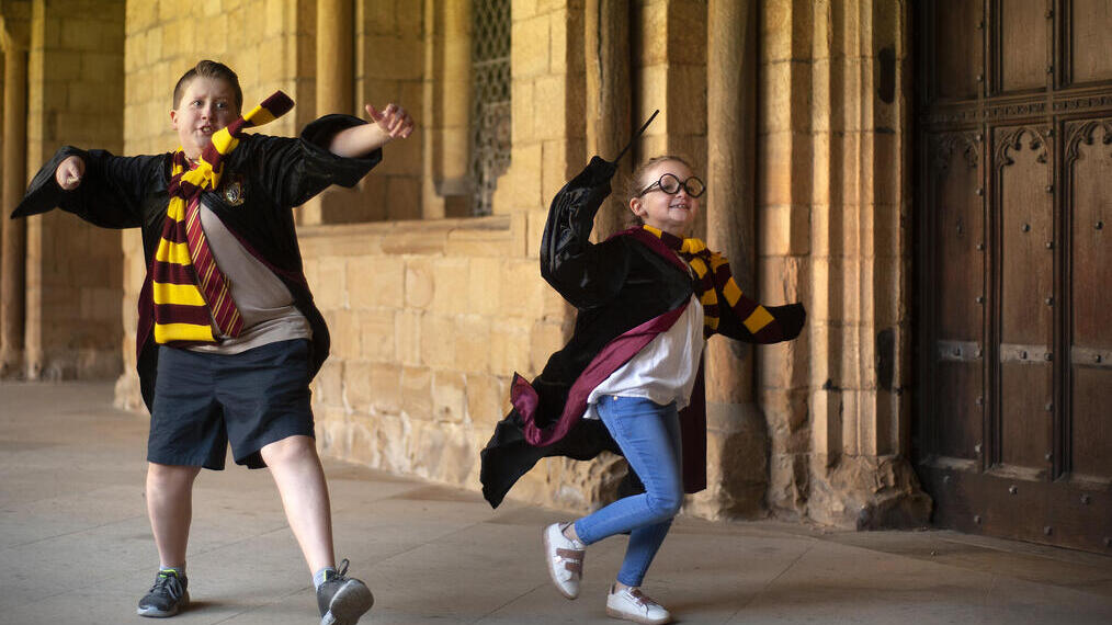 Two children dressed as Harry Potter characters at Durham Cathedral
