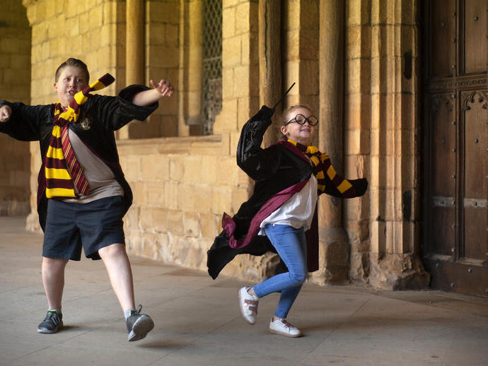 Two children dressed as Harry Potter characters at Durham Cathedral