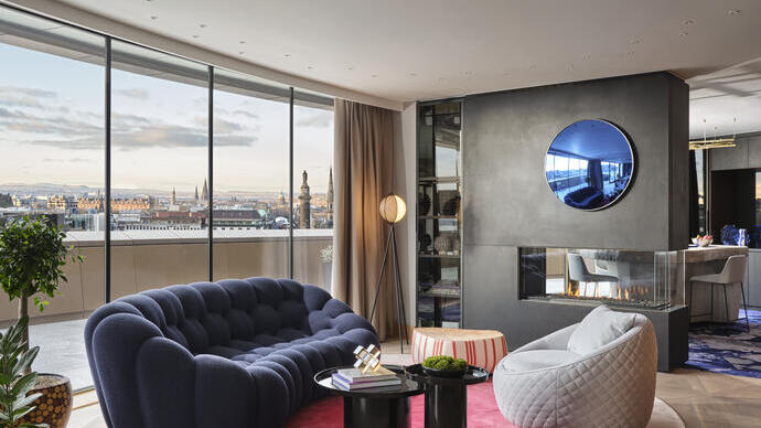 An interior shot of a hotel room in W Edinburgh with panoramic views across the city.