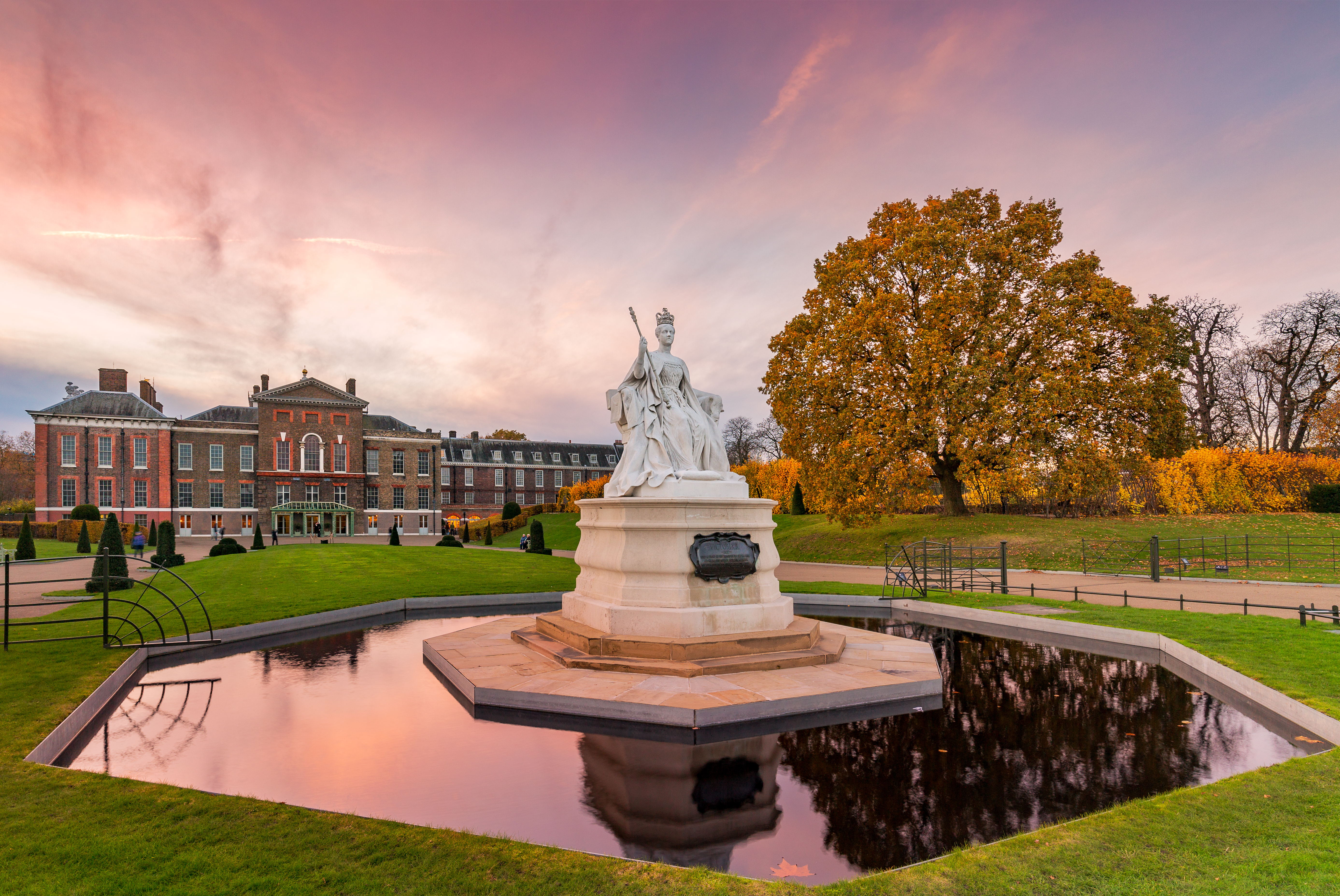 View of the garden at Kensington Palace including statue and pond