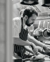 Chef preparing food at restaurant