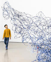 A child looking at an art exhibit in Leeds Art Gallery