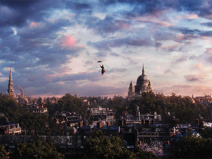Person with umbrella floats above a city skyline at sunset, St Paul's Cathedral visible among rooftops and trees.