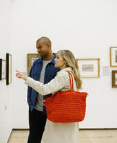 A couple looking at art displays in The Lowry, Greater Manchester