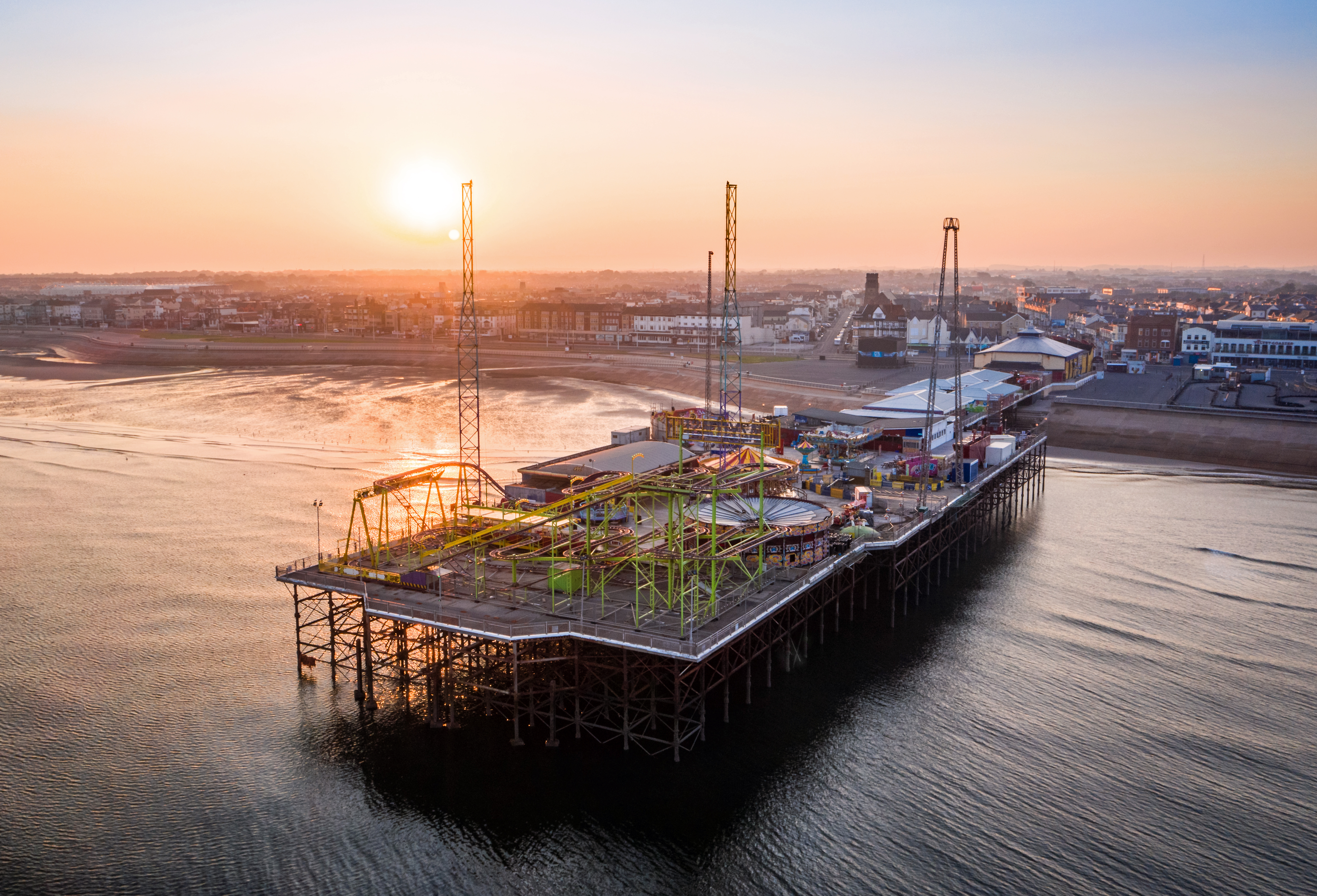 A seaside pier and funfair.