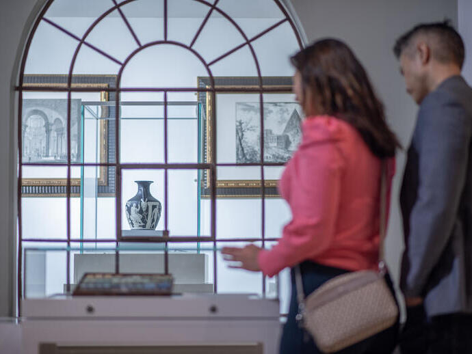 A woman and a man tour a museum