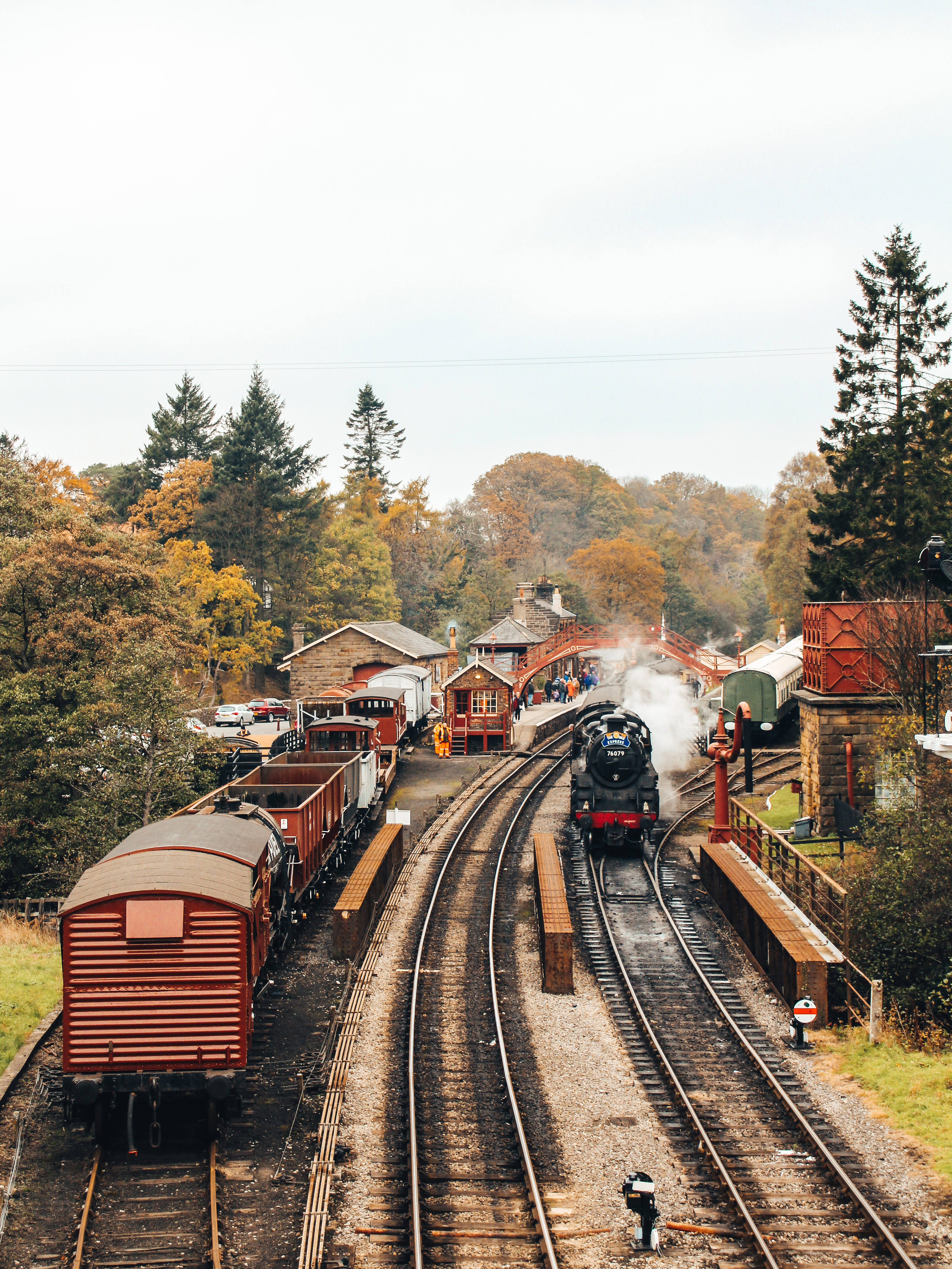 Steam train leaving a train station