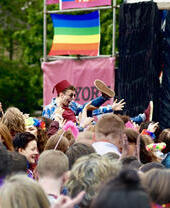A crowd watching a performance on stage at York Pride
