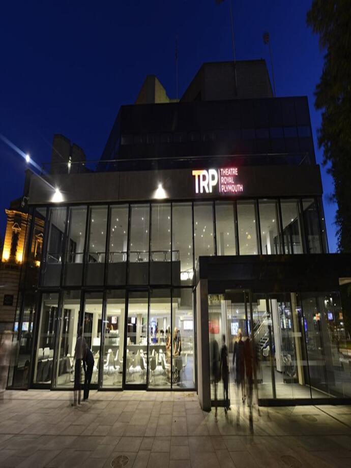 An outdoor nighttime view of the Theatre Royal Plymouth