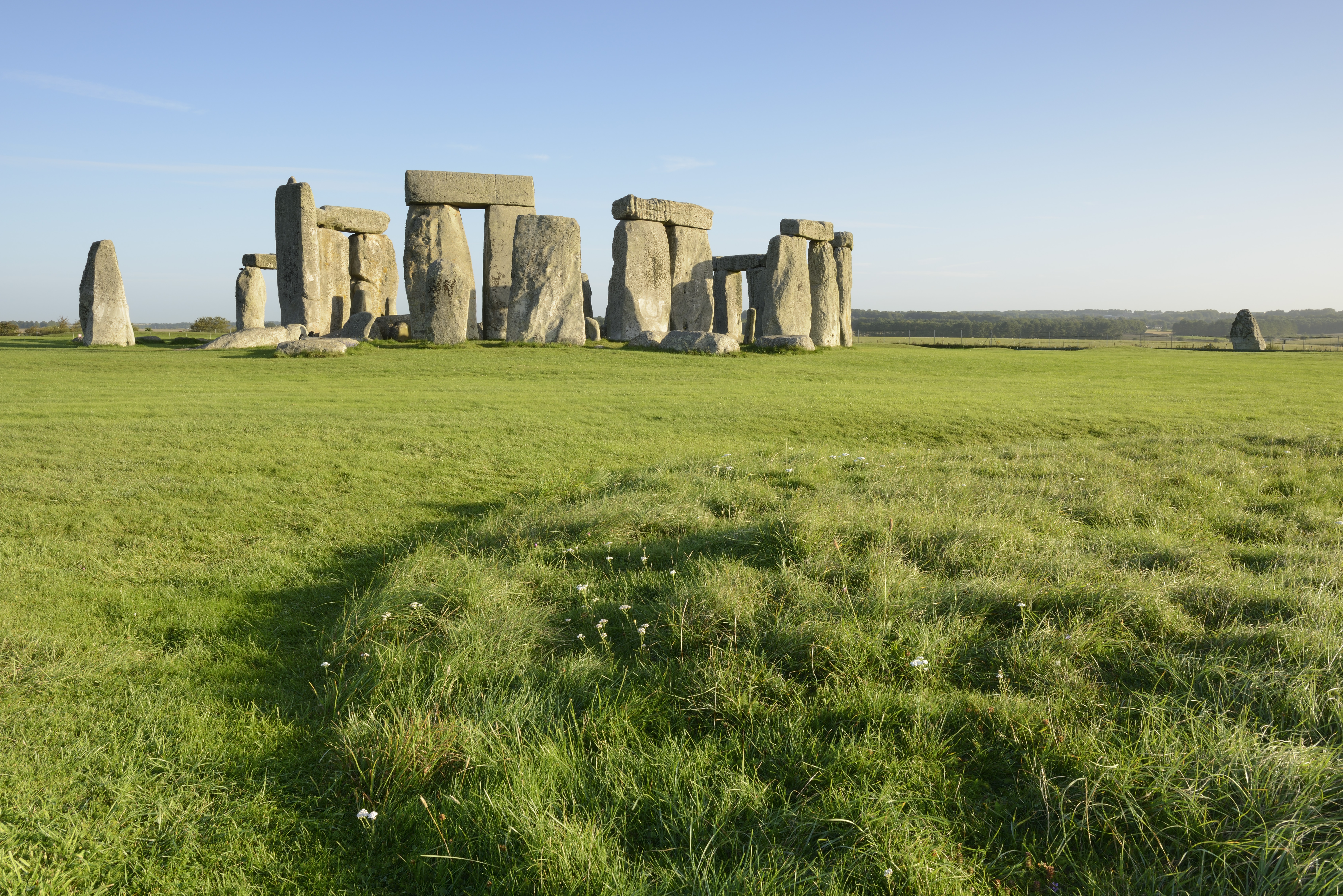 Large stone pillars arranged in circle on grass