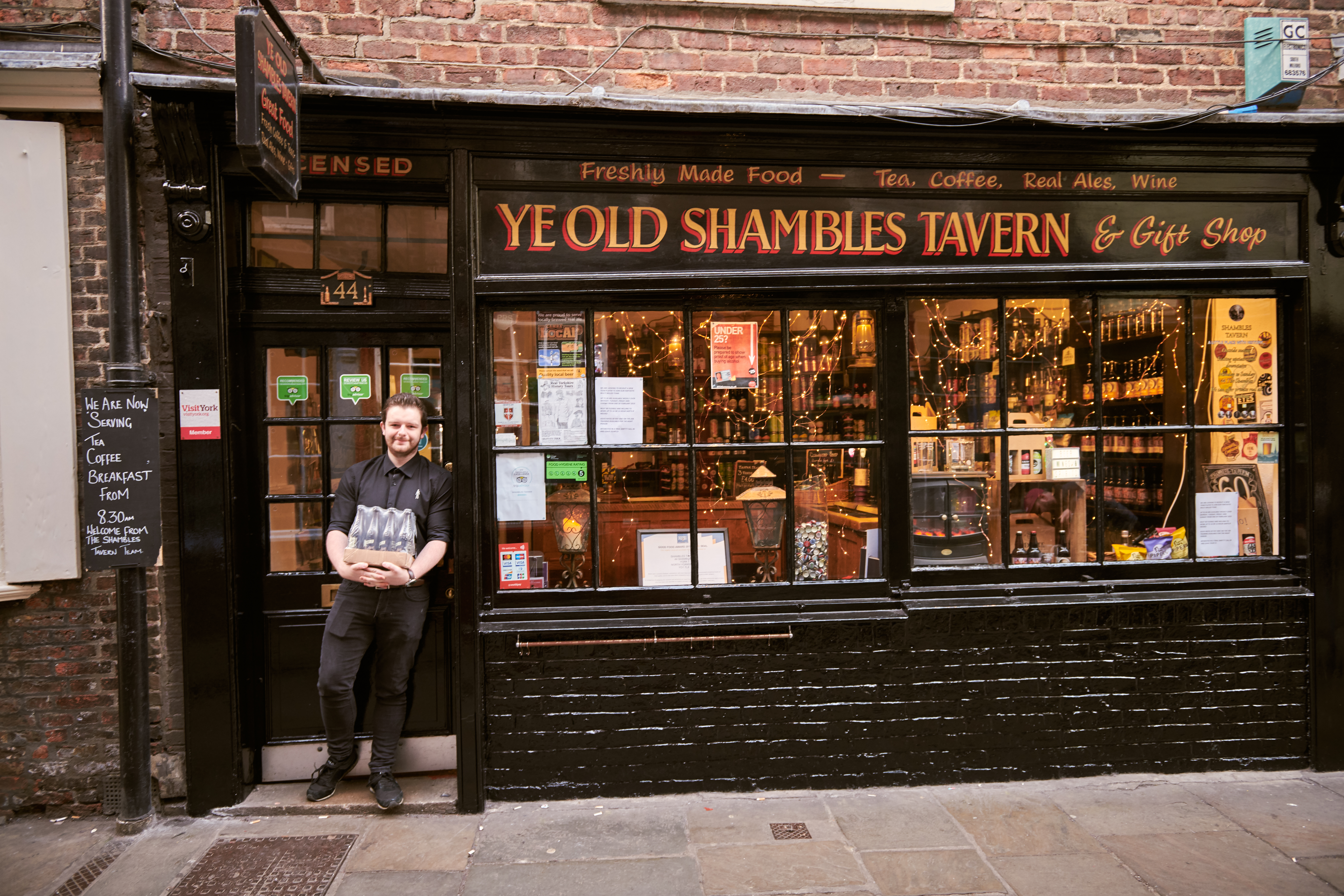 Man standing outside a shop