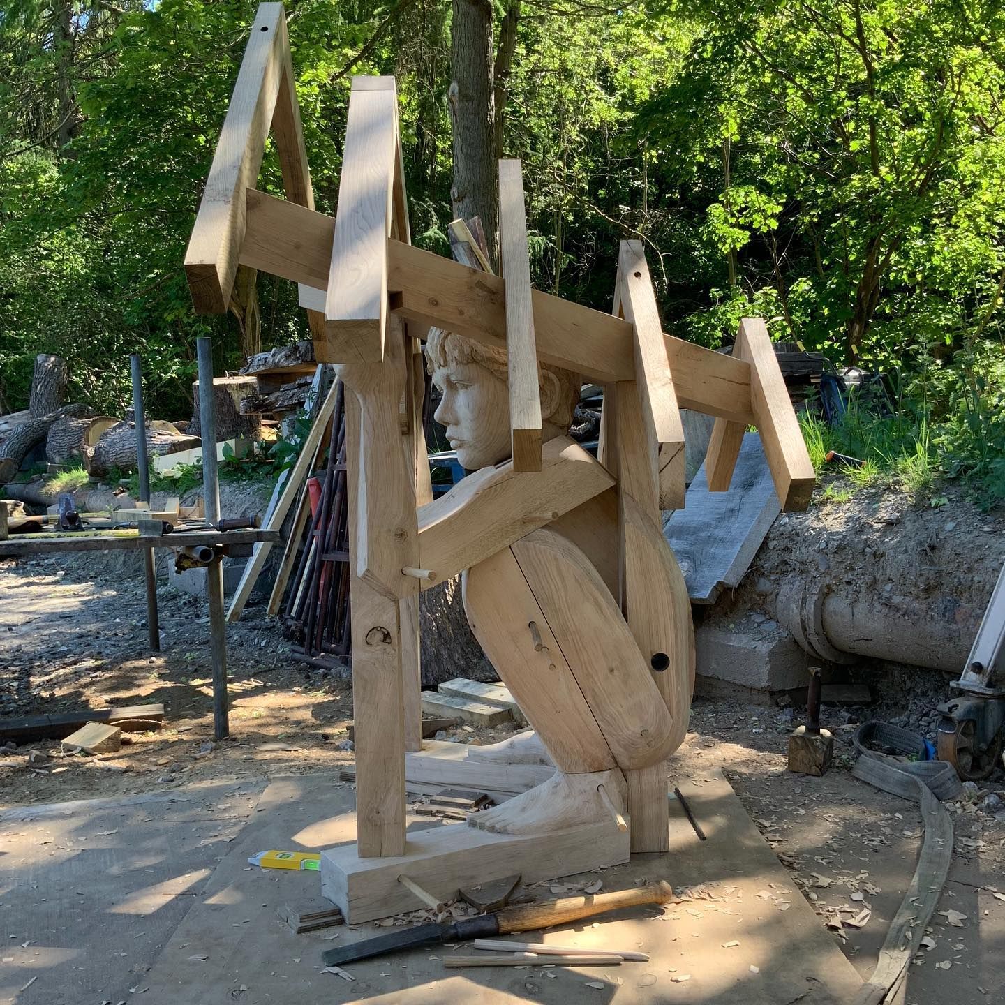 Large wooden sculpture of child at Ellesmere Sculpture Trail
