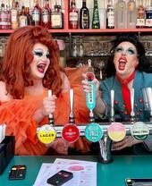 Two people pulling pints at Dalston Superstore