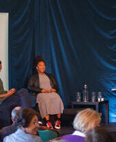 A talk on stage at The Bath Festival