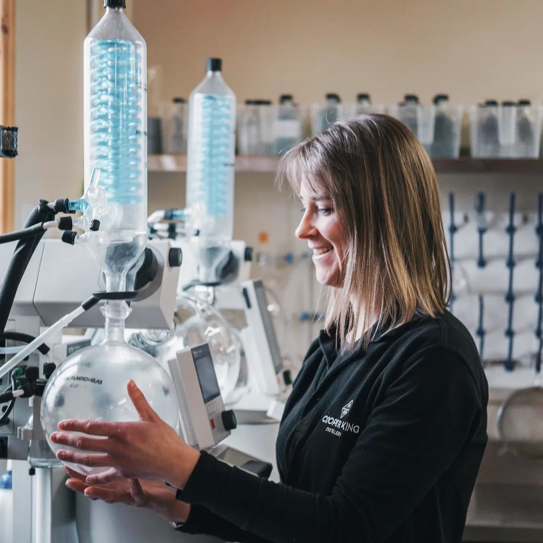 Woman leading a tour of the Cooper King gin distillery in York