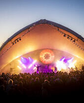 Spring Classic Festival crowd at sunset Main stage illuminated