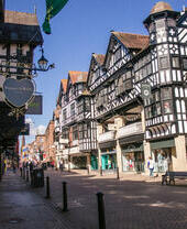 City high street with historic buildings and shops