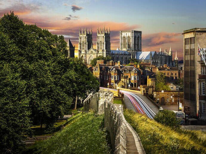 A minster in the centre of a city taken from the city stone wall