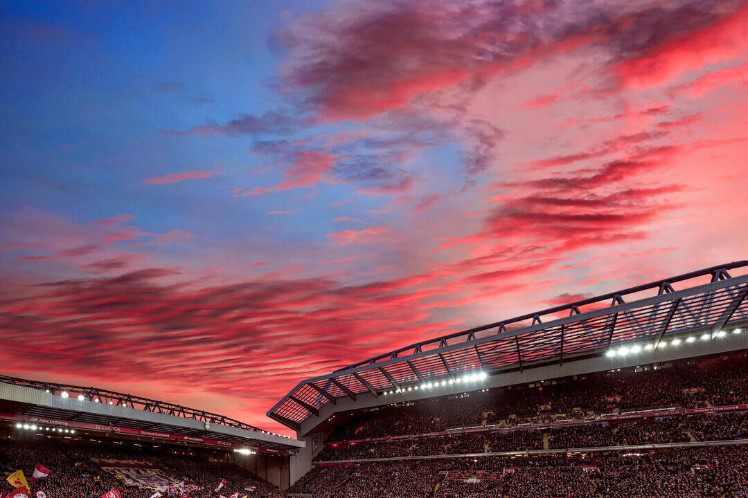 Red clouds in sunset over the ground of a stadium
