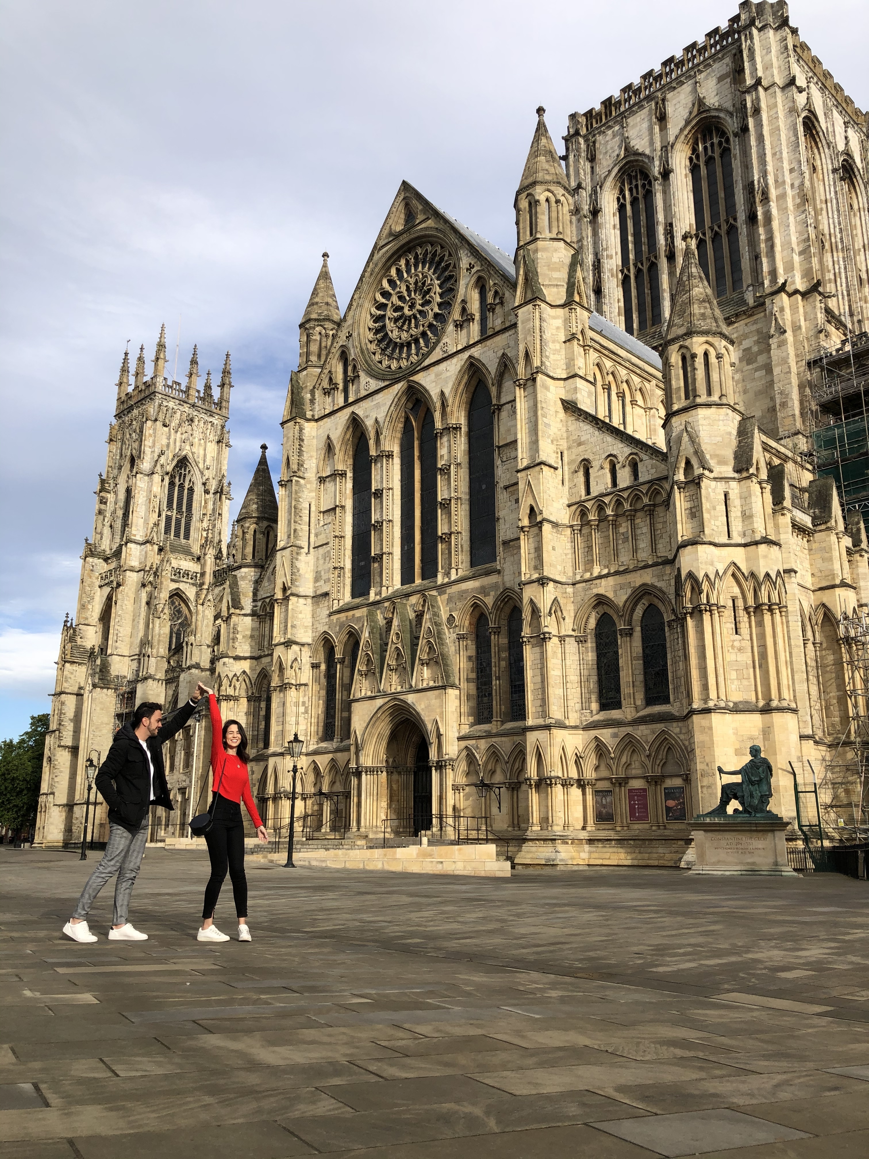 Man and woman dancing outside an historic building