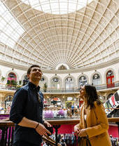 People looking around the interior of Leeds Corn Exchange