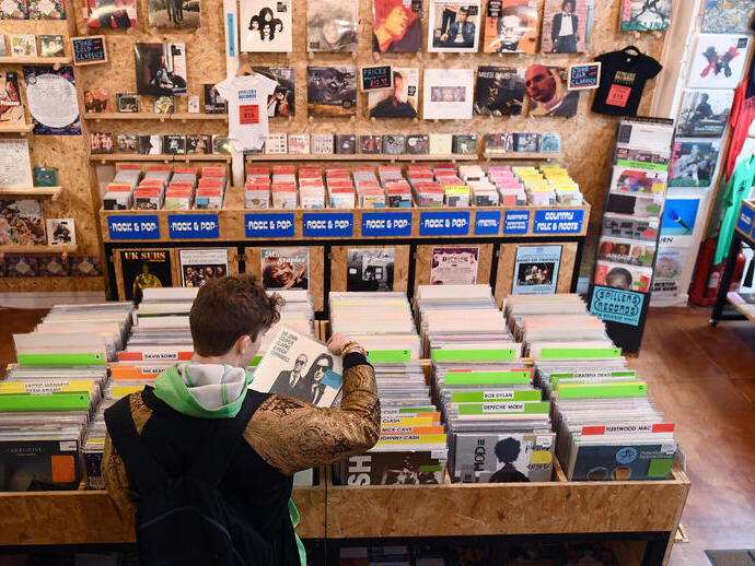 A man looks through records at Spillers Records in Cardiff