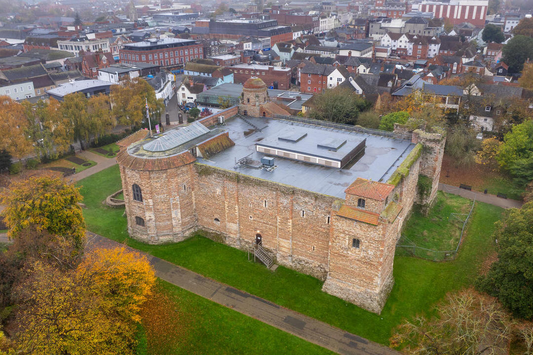 Aerial view of castle with town in the background