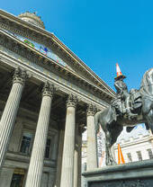 Gallery of Modern Art in Glasgow with the equestrian Wellington Statue, most often featured with a traffic cone on his head.