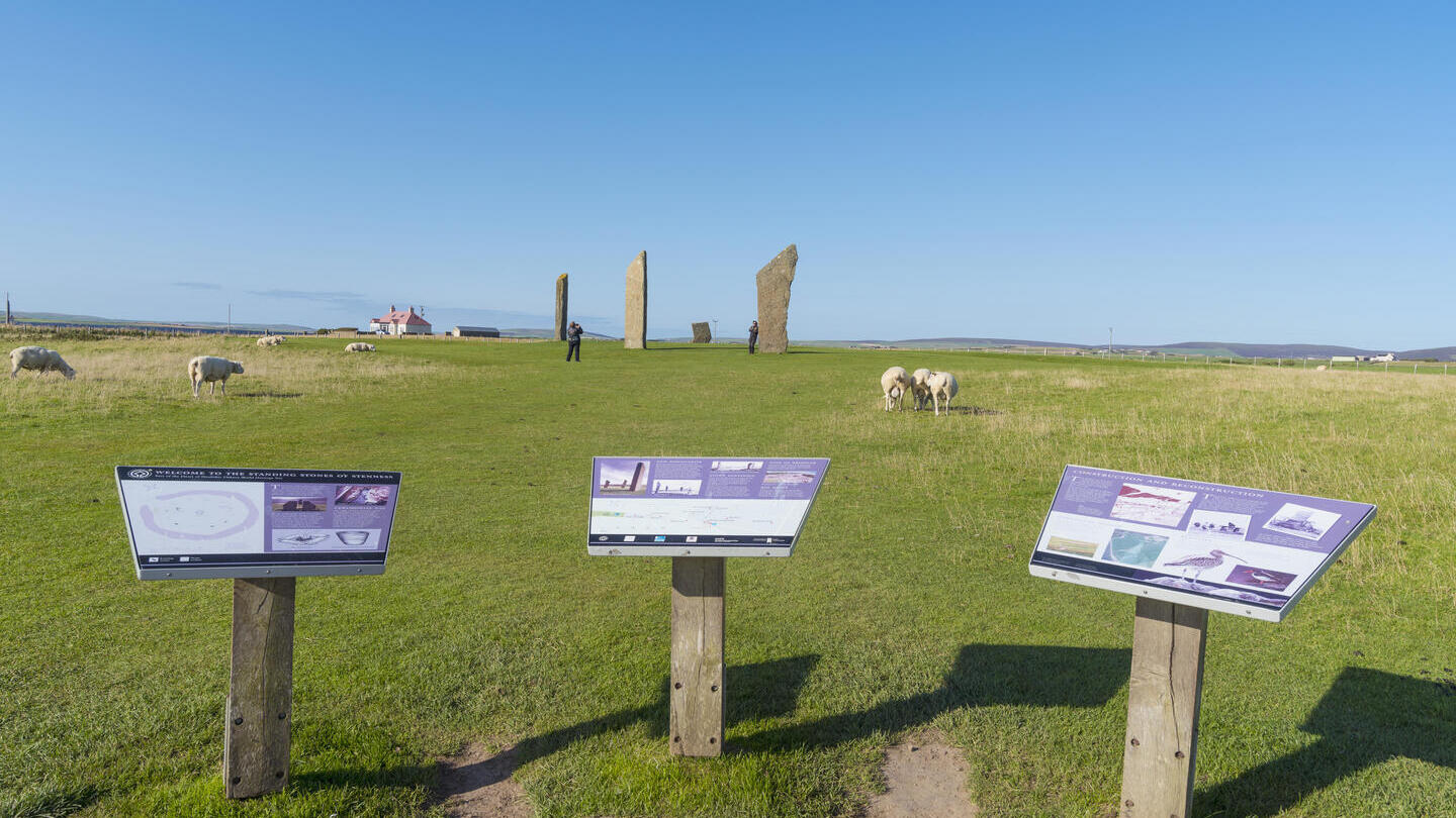 Standing Stones of Stenness in Scotland, with placards at the front
