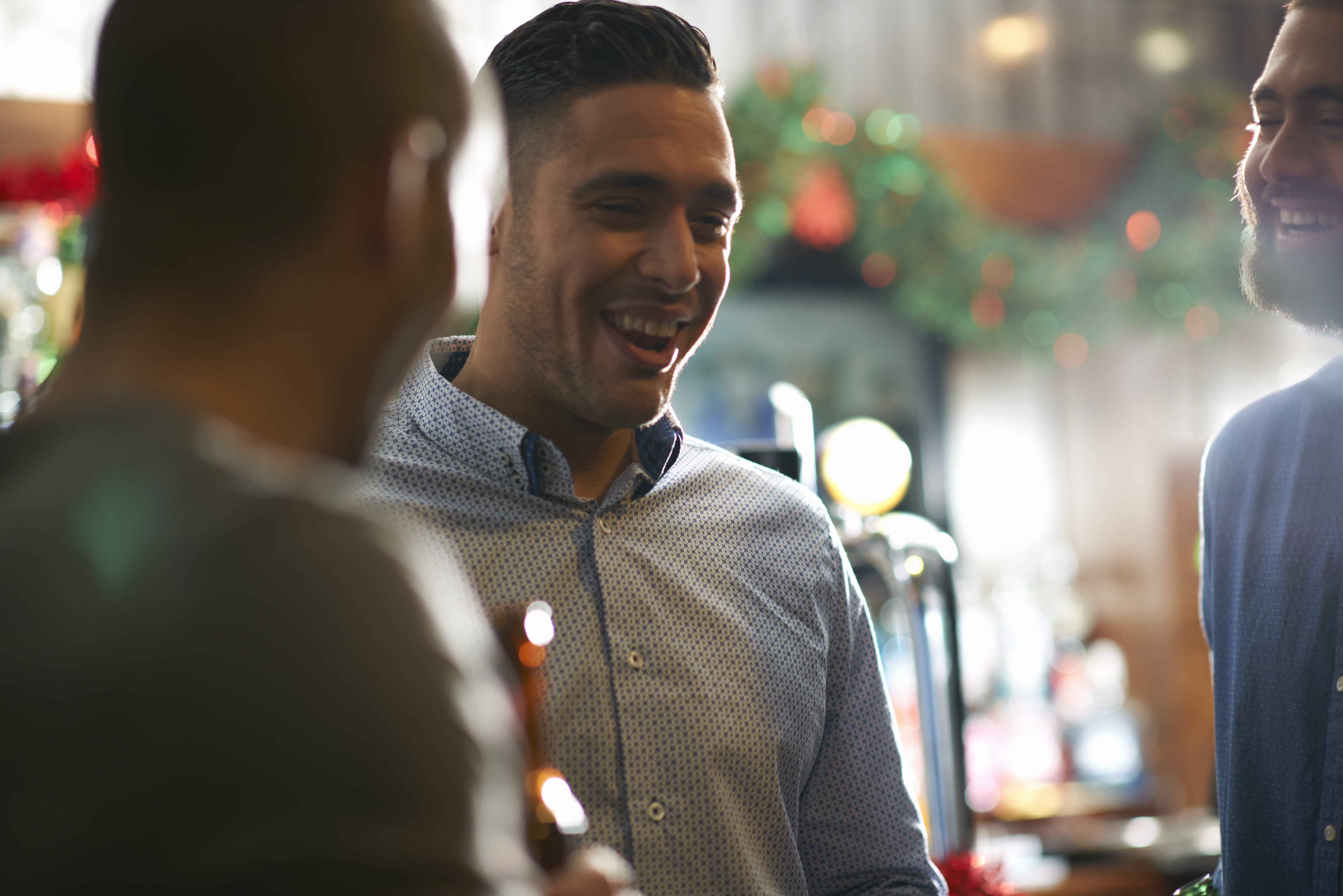 A group of people drinking at a bar