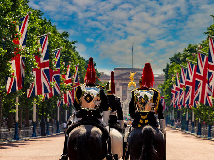 Military Guards on horses between rows of Union jack flags