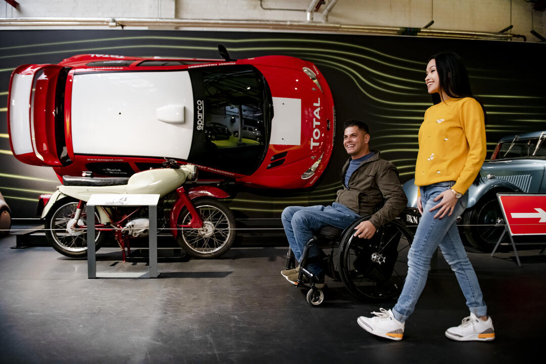 Woman and man using a wheelchair in a museum