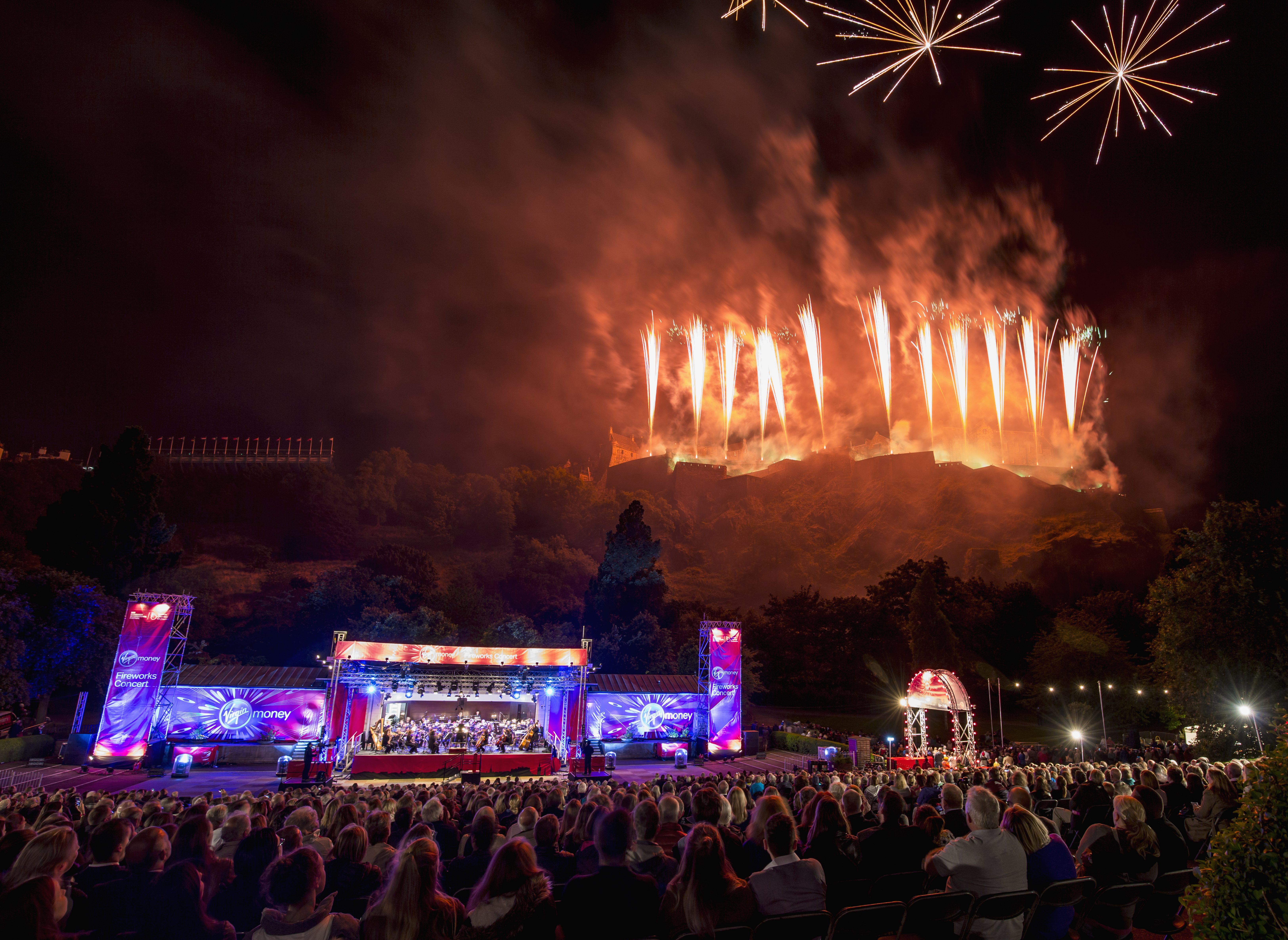 View of main stage at Edinburgh's Hogmanay event, with pyro displays in the background